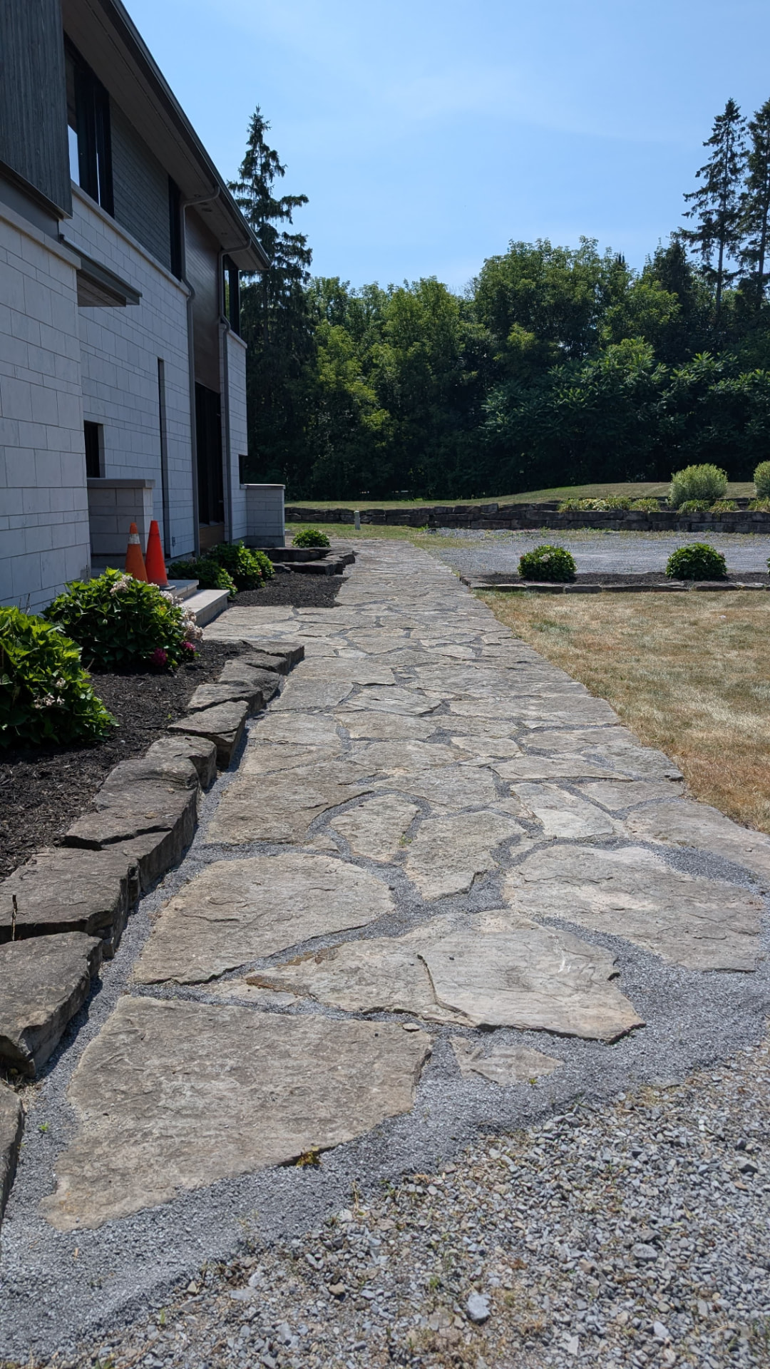 Restored flagstone walkway with clean gravel joints