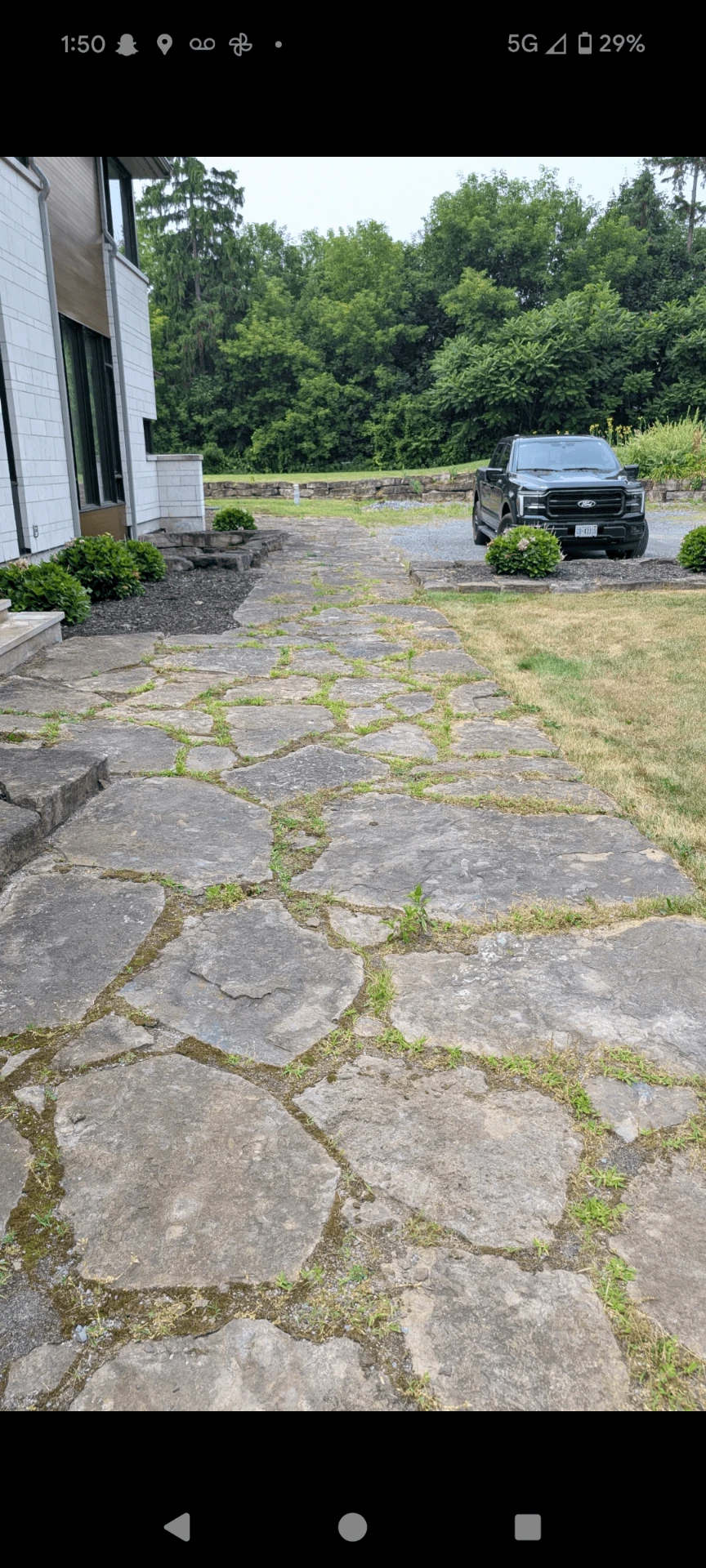 Flagstone walkway before and after restoration by SD&G Contracting — before