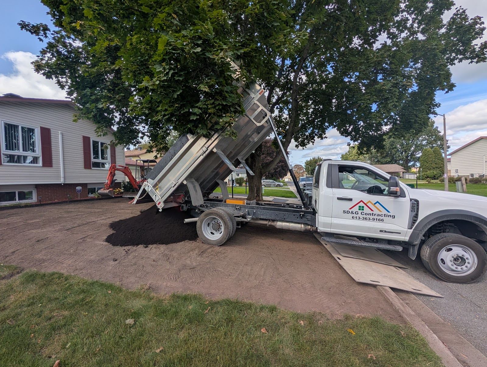 Dump truck used by SD&G Contracting for lawn care in Cornwall, Ontario