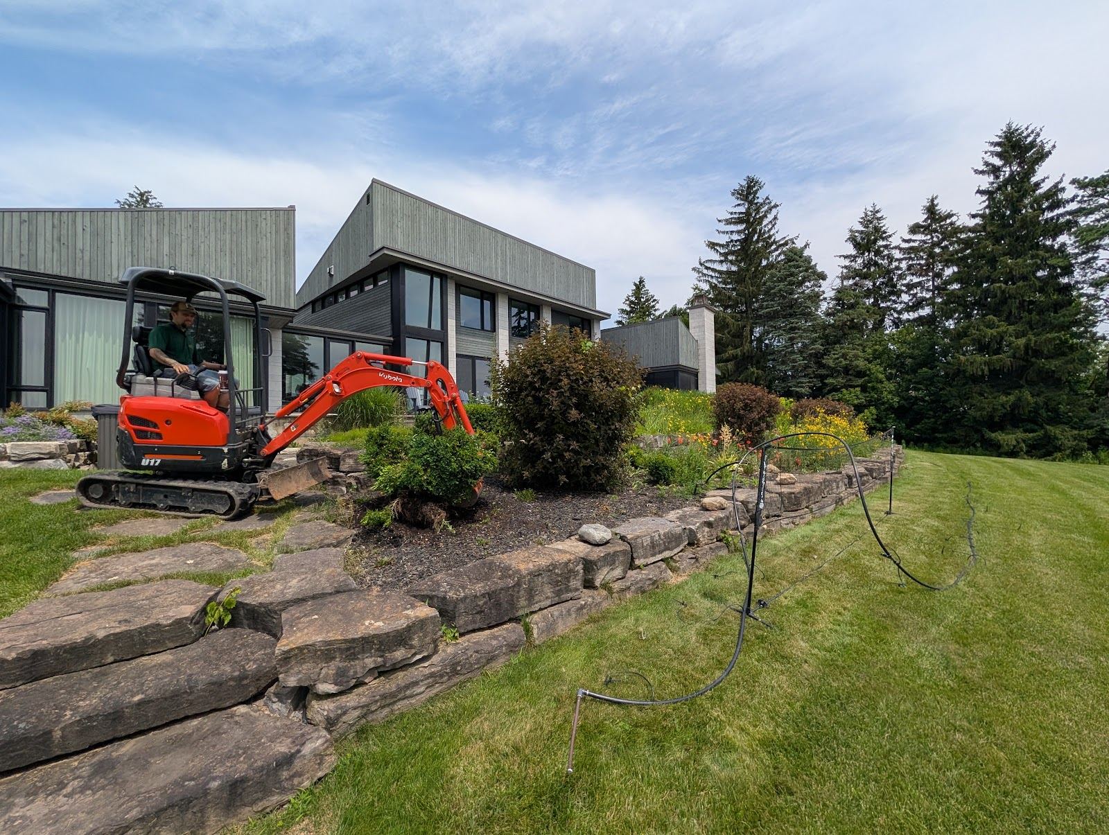 Mini excavator used by SD&G Contracting for lawn care in Cornwall, Ontario