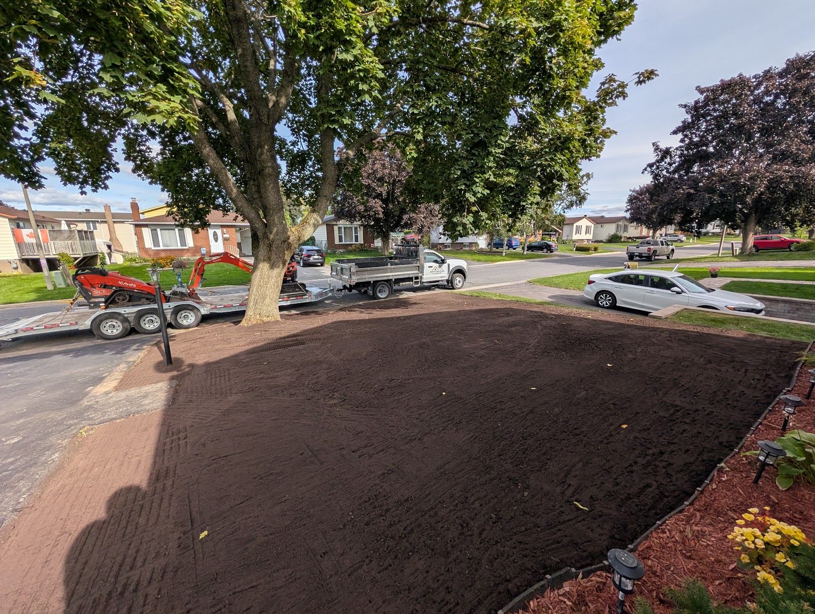 Graded topsoil prepared for new sod at a Cornwall, Ontario home
