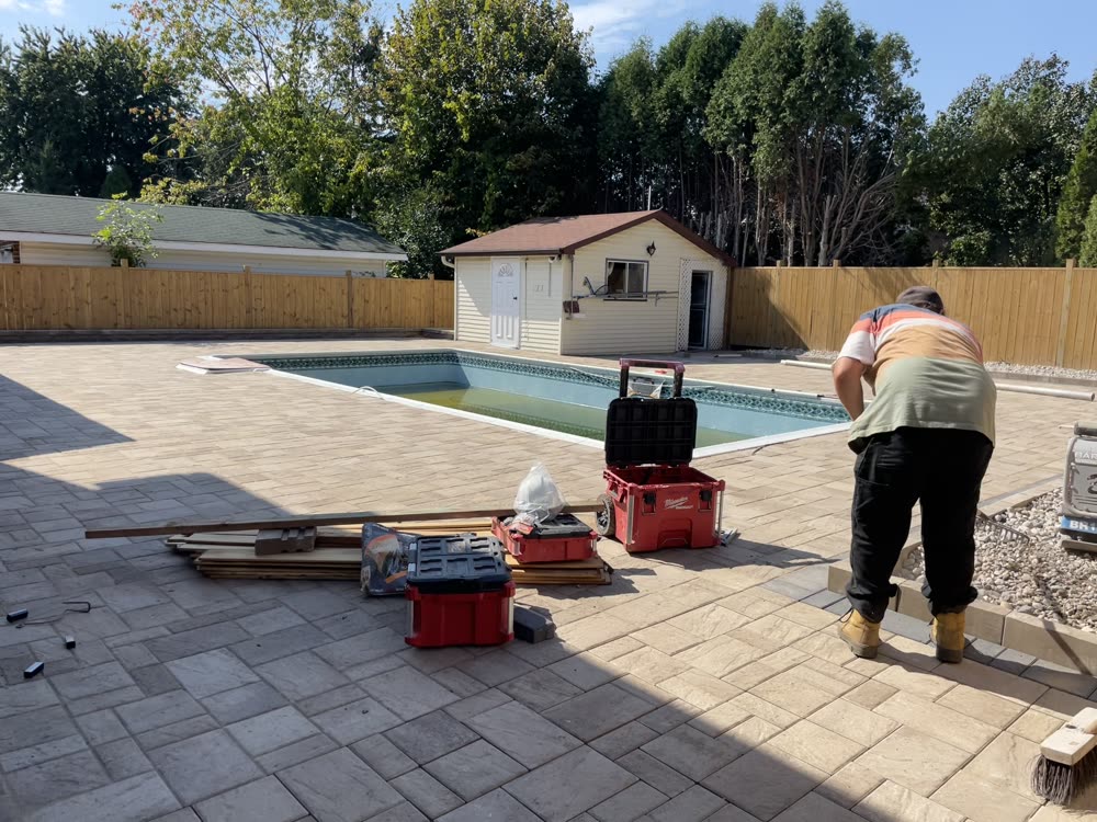 Finished interlock pool deck around an in-ground pool